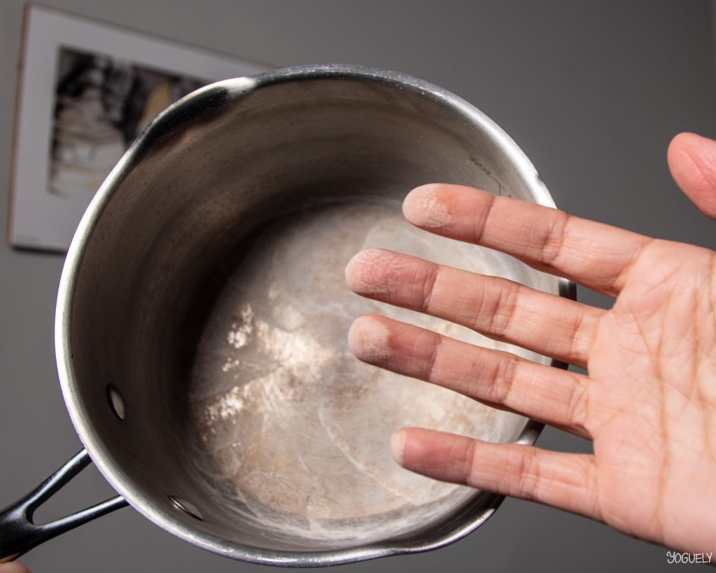 Boiling tap water completely leaves behind dissolved solids, known as limescale and hard water spots. These chaulky white substances are contaminants in the tap water.