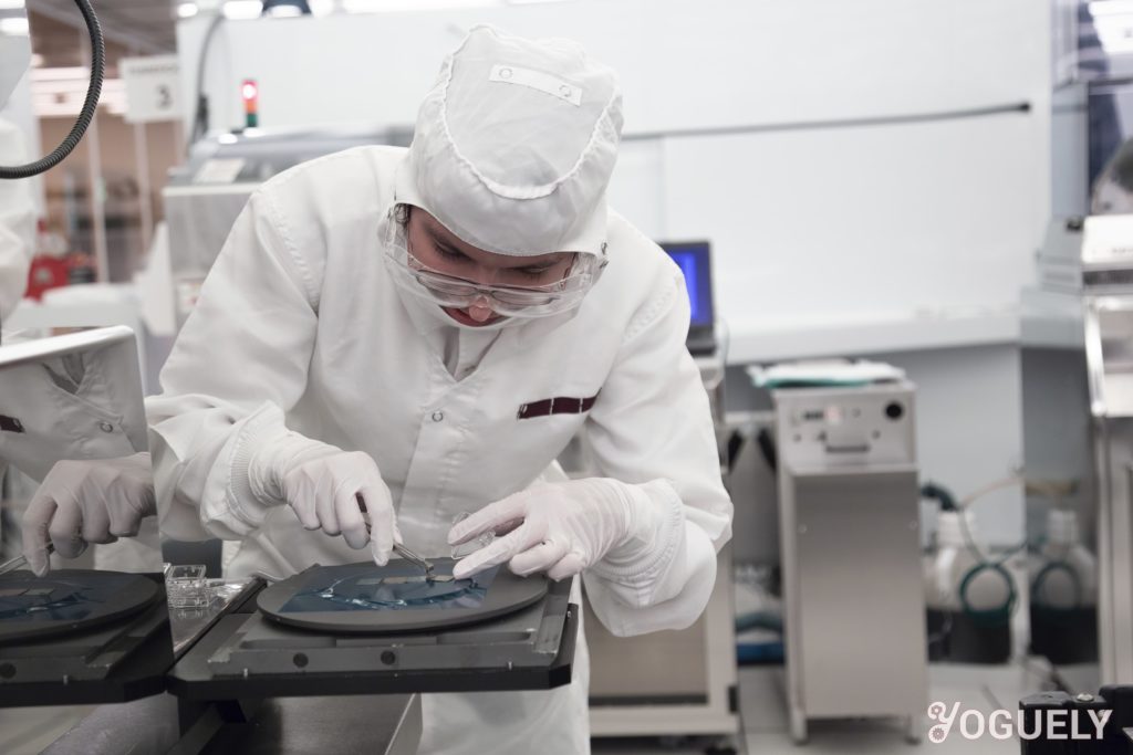 Aida Yoguely gowned with full PPE as she works in the cleanroom developing nanotechnology.